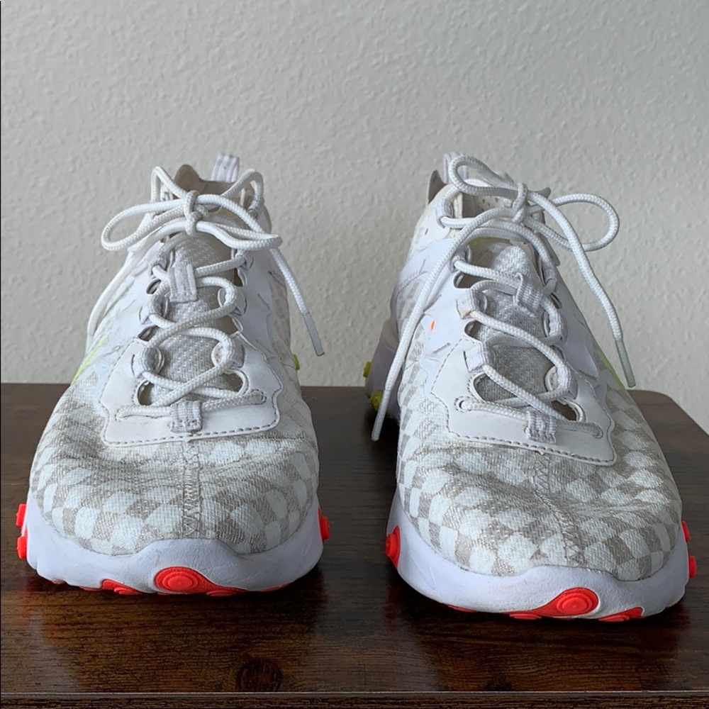 White Nike react with neon yellow and orange.